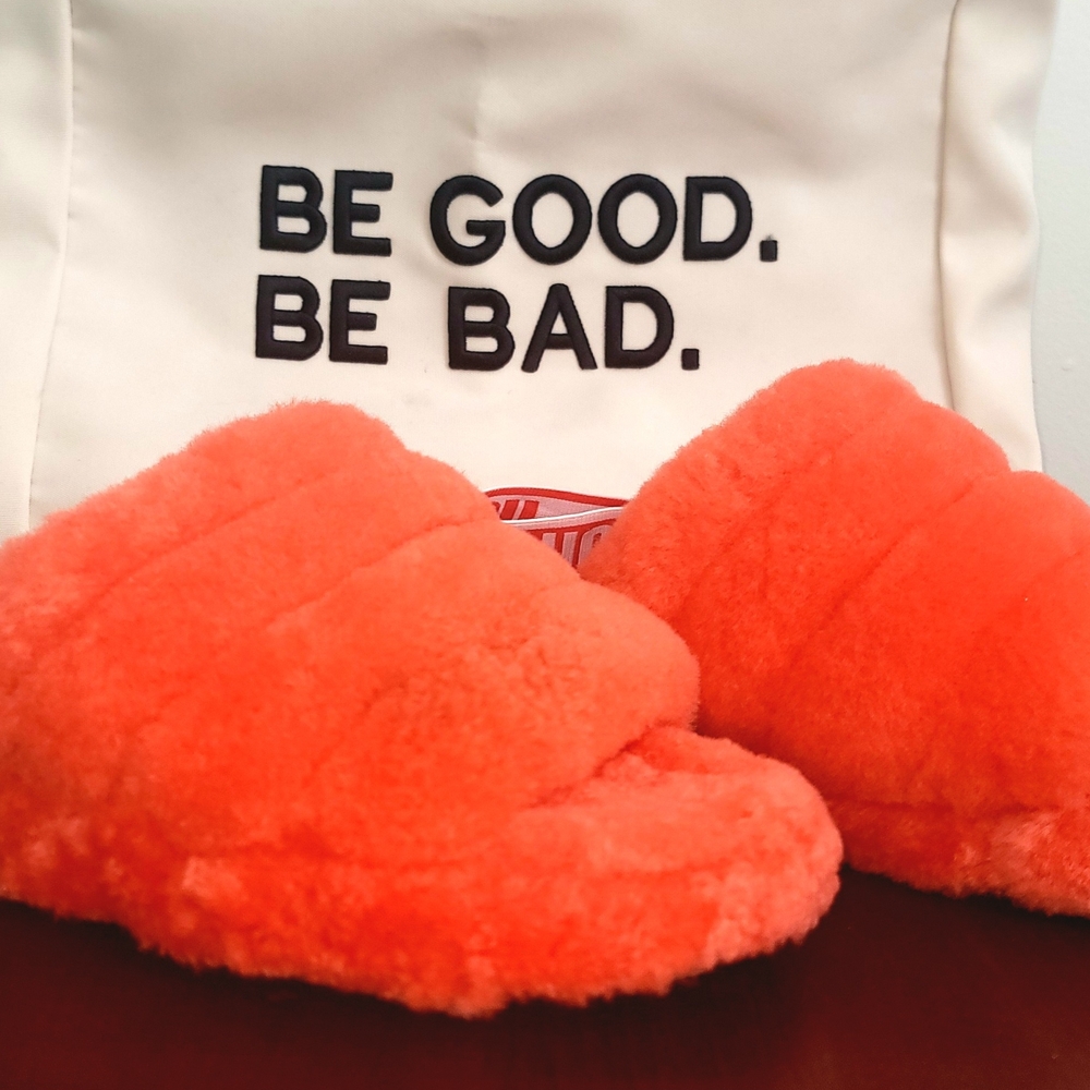 Plush Fuzzy Orange Slippers with 'Be Good. Be Bad.' Accent